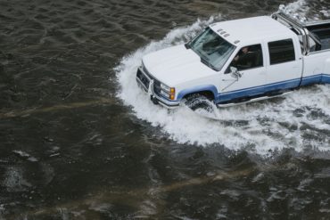 truck driving thru flood