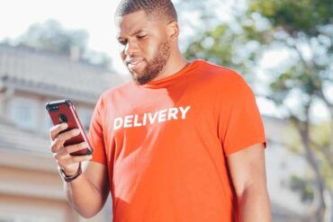 delivery driver checking their phone,