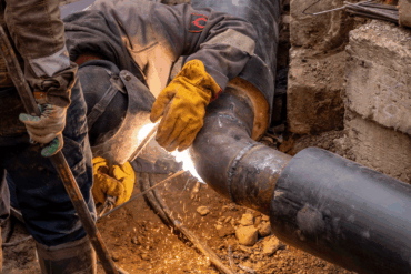 plumber working on septic tank